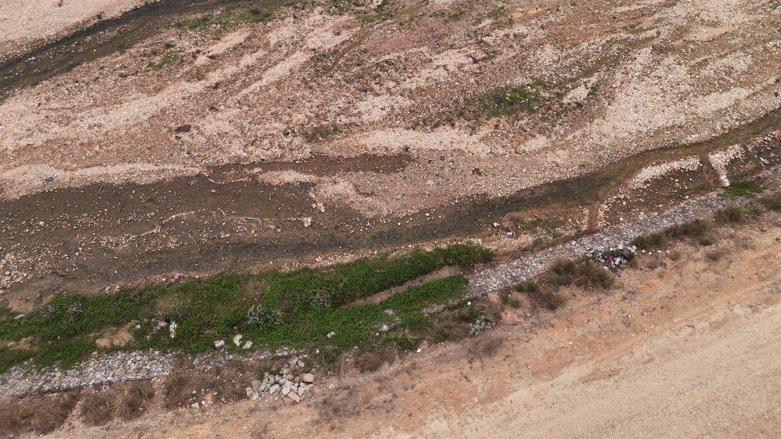 Aerial view of the Morowali industrial park smelters beside a low river channel in the dry season, Central Sulawesi